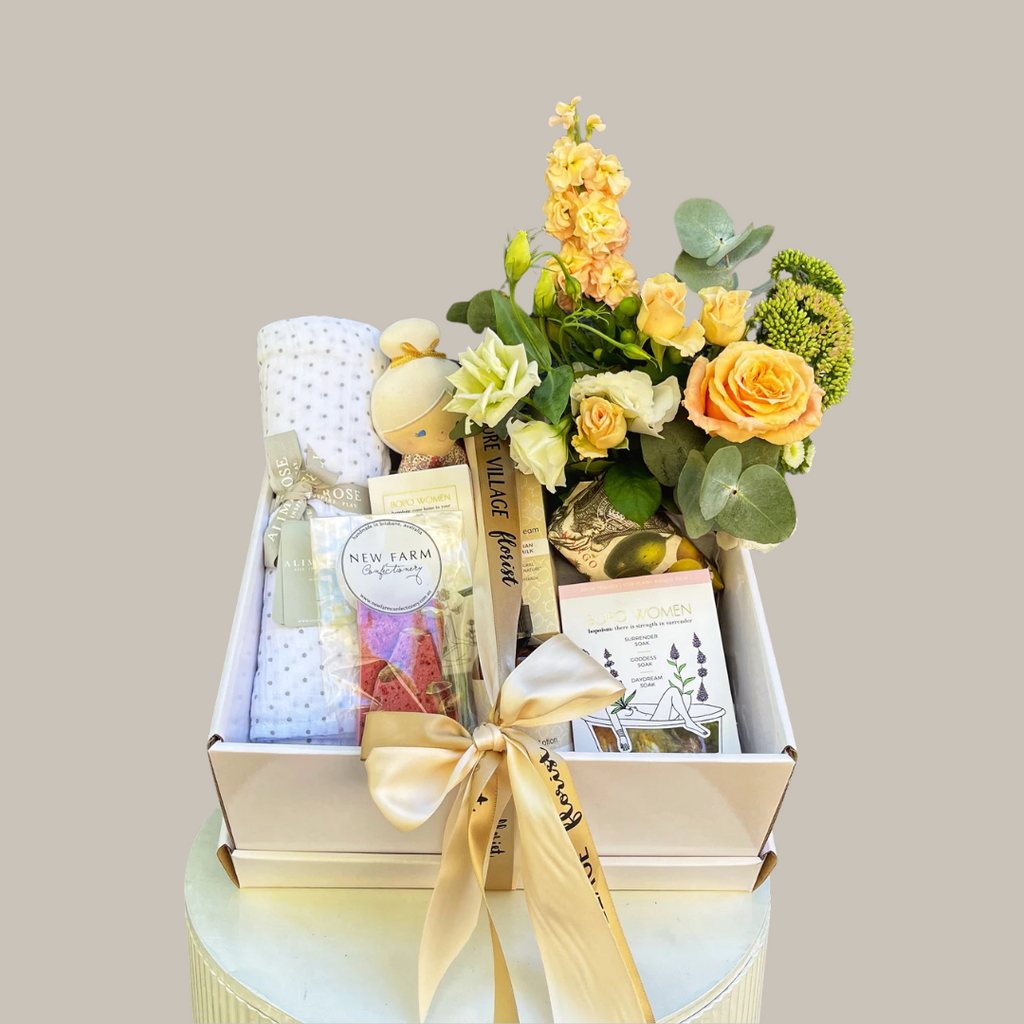 Gift hamper with flowers and baby products. Kenmore Village Florist. Brisbane hamper delivery. Same day delivery available.