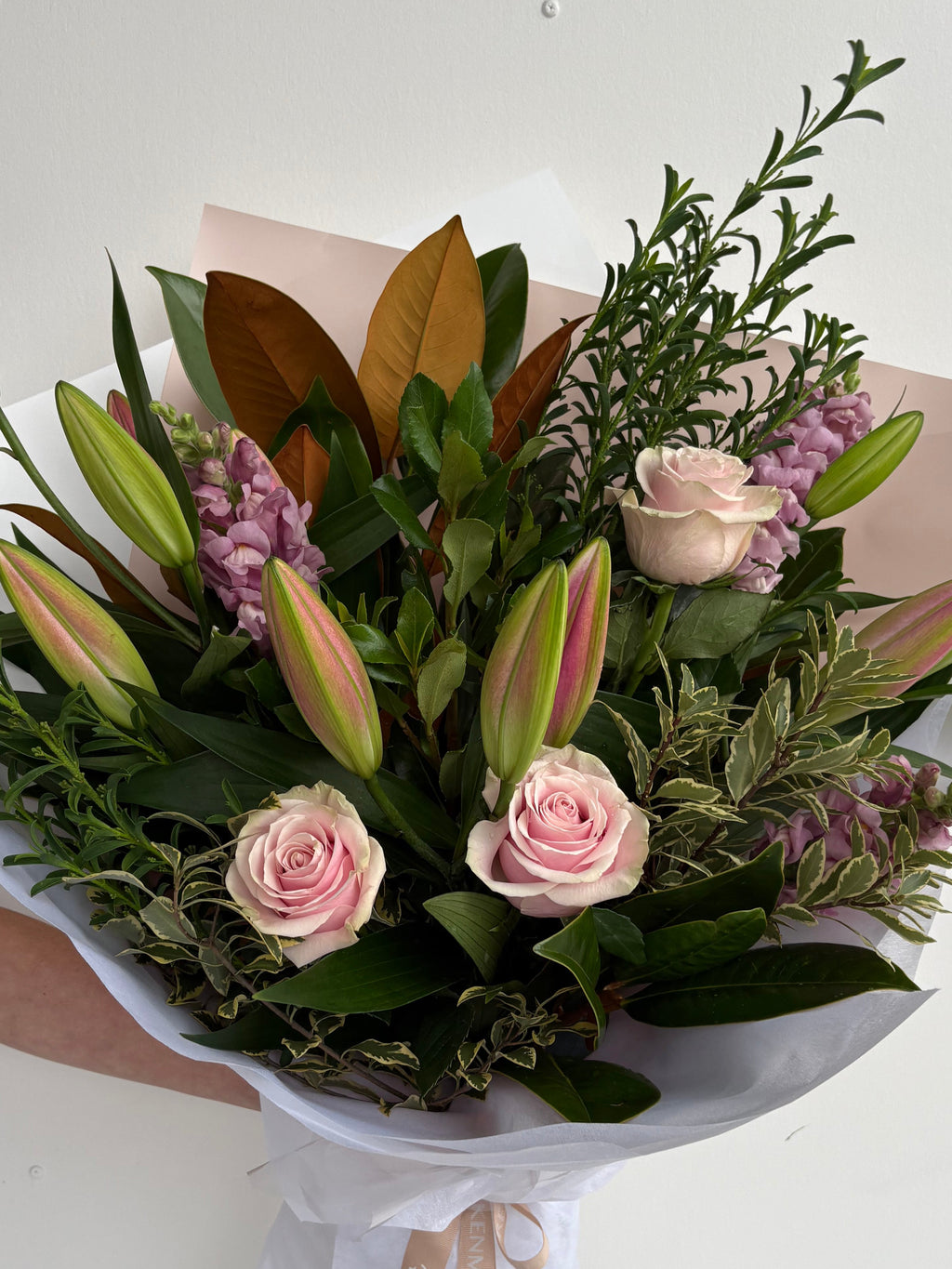 A bouquet of flowers featuring oriental lilies and roses. Kenmore Village Florist, Brisbane Flower Delivery.