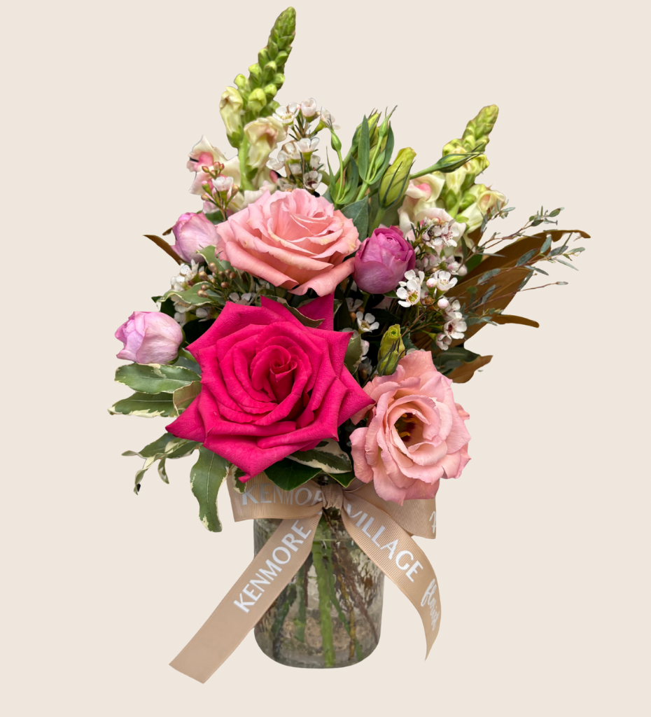 Jar of pink roses with seasonal flowers and greenery in a clear vase. Kenmore Village Florist, Brisbane Flower Delivery.