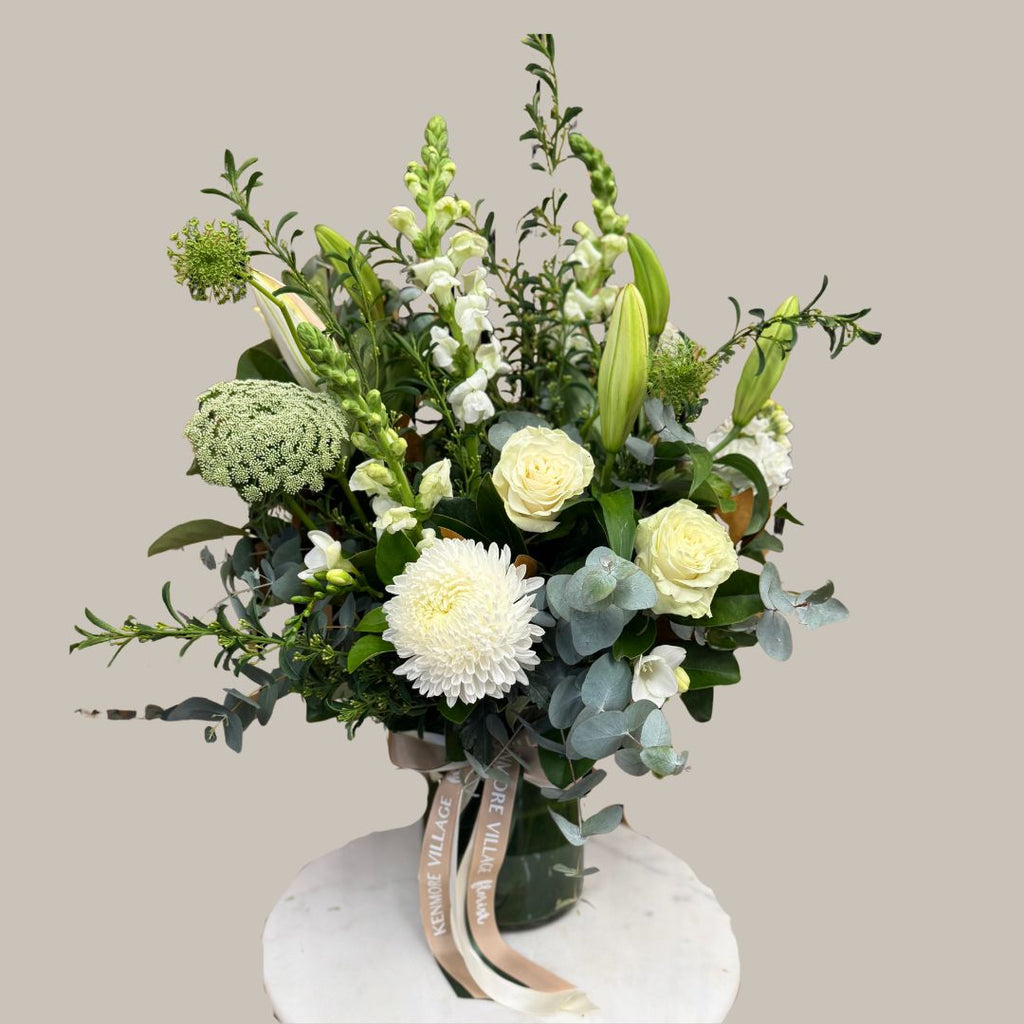 Vase of green and white flowers for Sympathy. Kenmore Village Florist. Brisbane Flower Delivery.