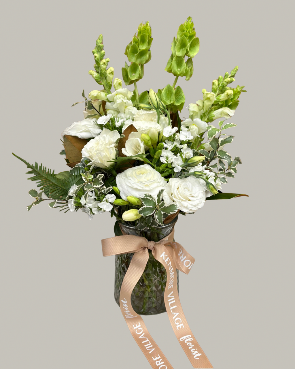 Vase of seasonal white flowers for sympathy. Kenmore Village Florist, Brisbane.