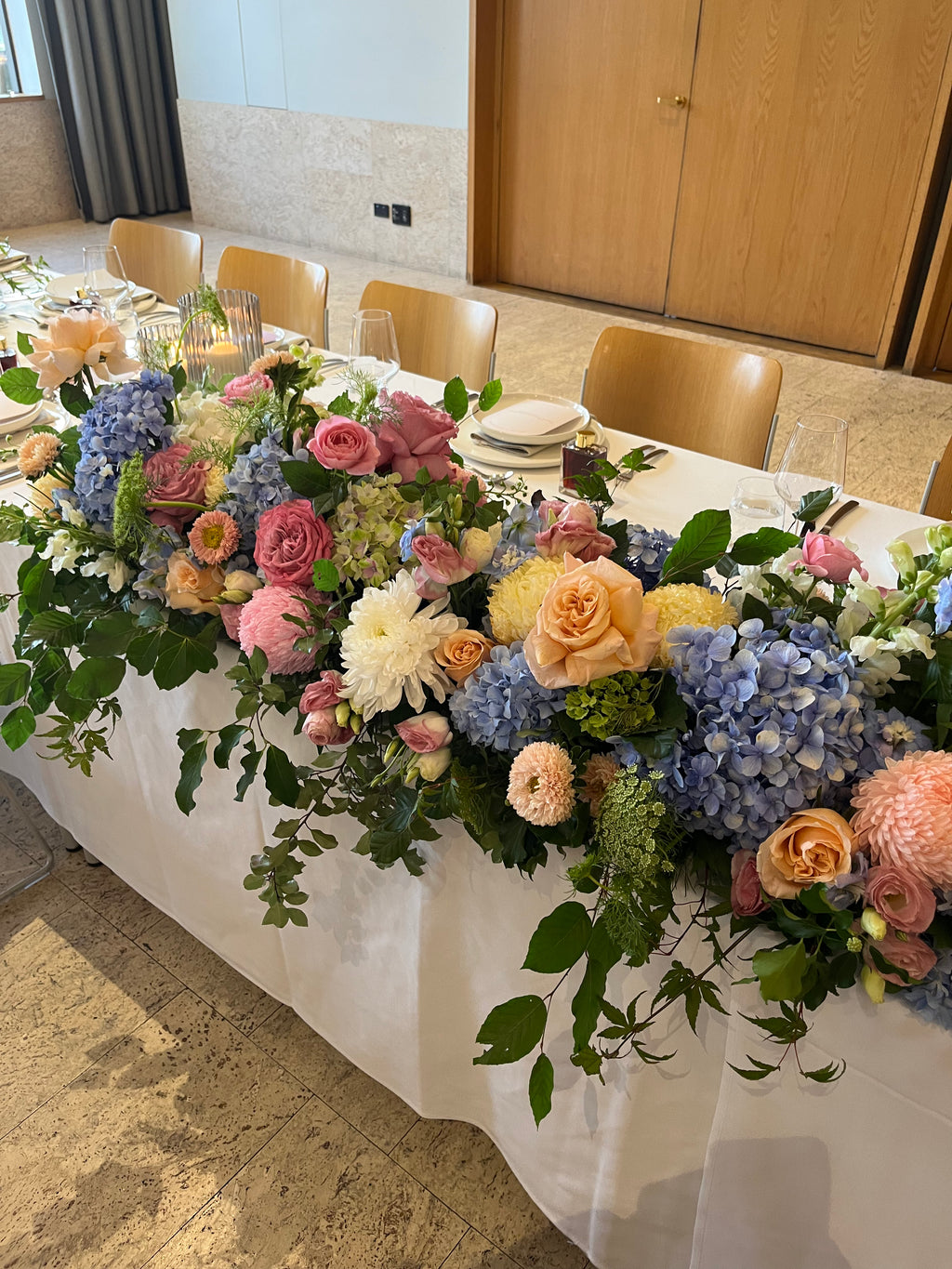 Decorative floral luxury table arrangement suitable for a wedding/event or party. Kenmore Village Florist