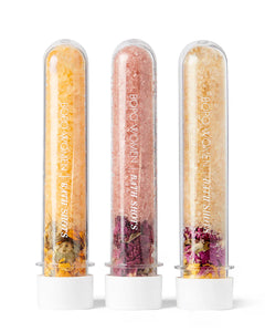Three cylindrical containers with floral elements. Brisbane gift and flower shop. Kenmore Village Florist.