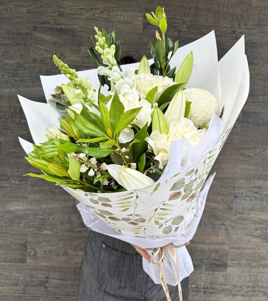 A bouquet of white lilies and mixed seasonal blooms. Kenmore Village Florist, Brisbane Flower Delivery.