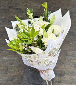 A bouquet of white lilies and mixed seasonal blooms. Kenmore Village Florist, Brisbane Flower Delivery.
